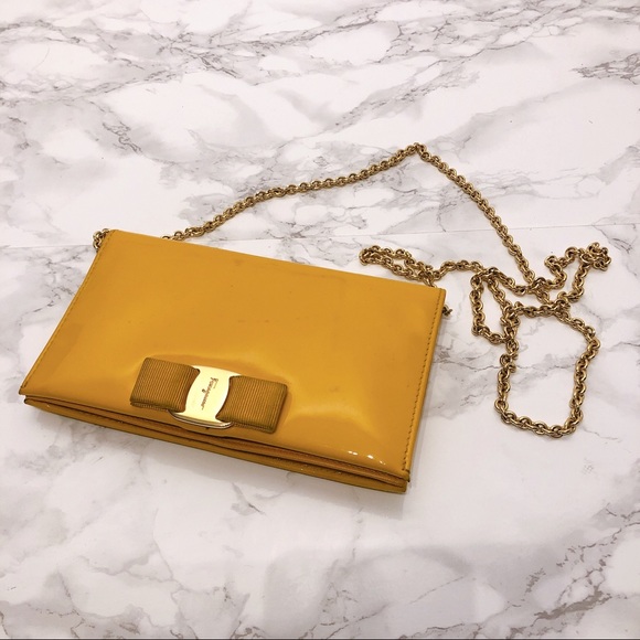 Salvatore Ferragamo Handbags - Ferragamo yellow patent wallet on chain
